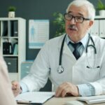 Doctor discussing checkup results with a patient in a clinic