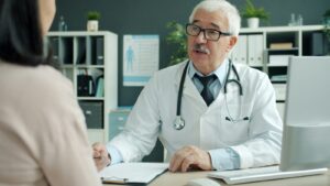 Doctor discussing checkup results with a patient in a clinic